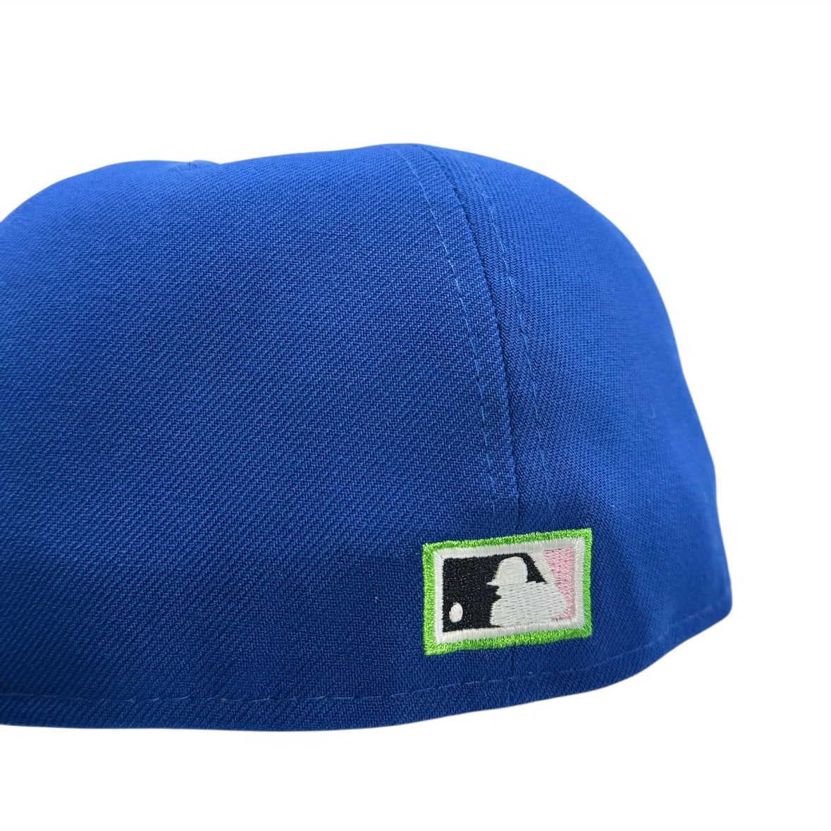 Blue cap with a logo patch on a white background